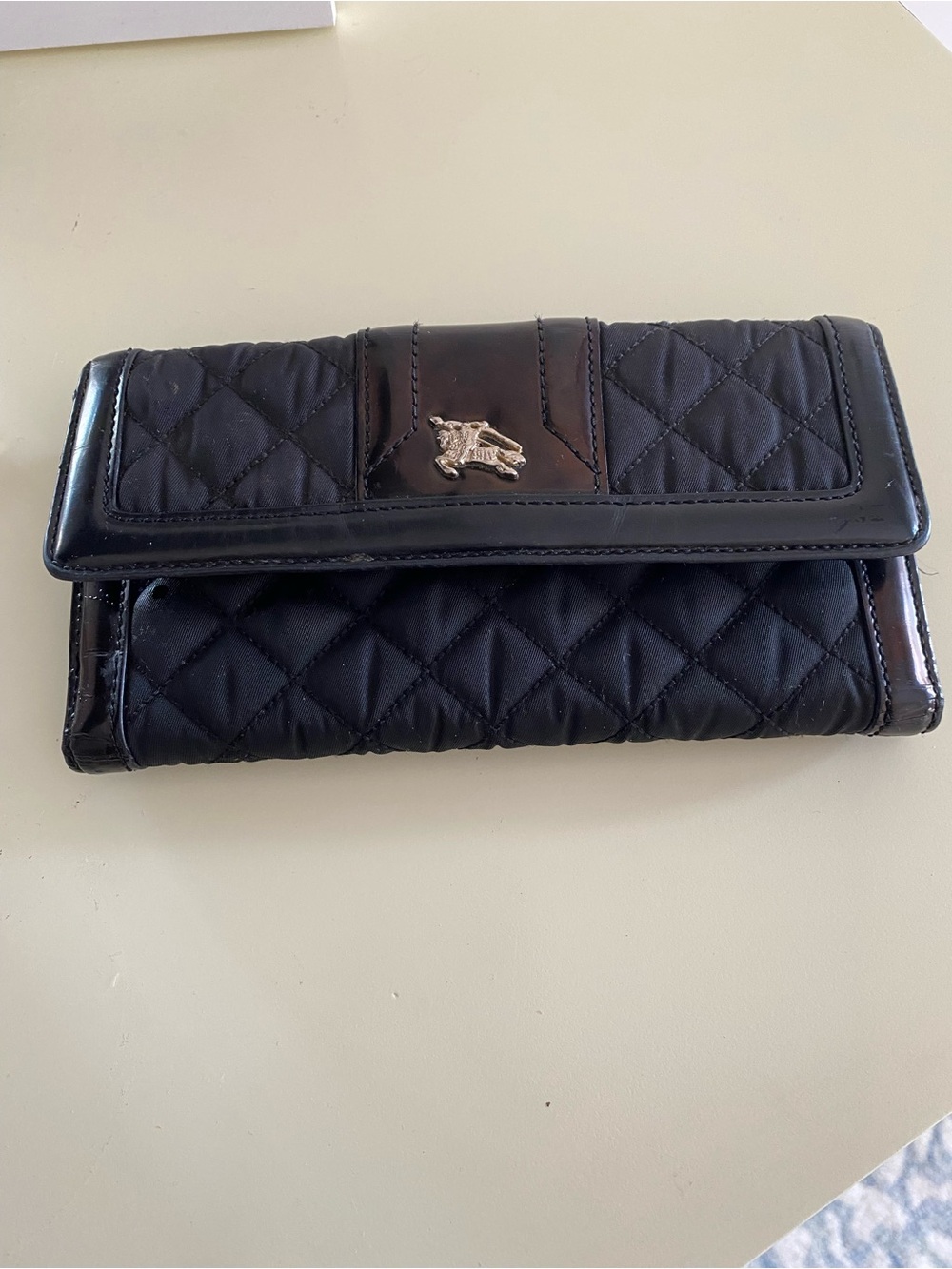 BURBERRY Quilted Black Women's Wallet with silver Burberry signature accent.